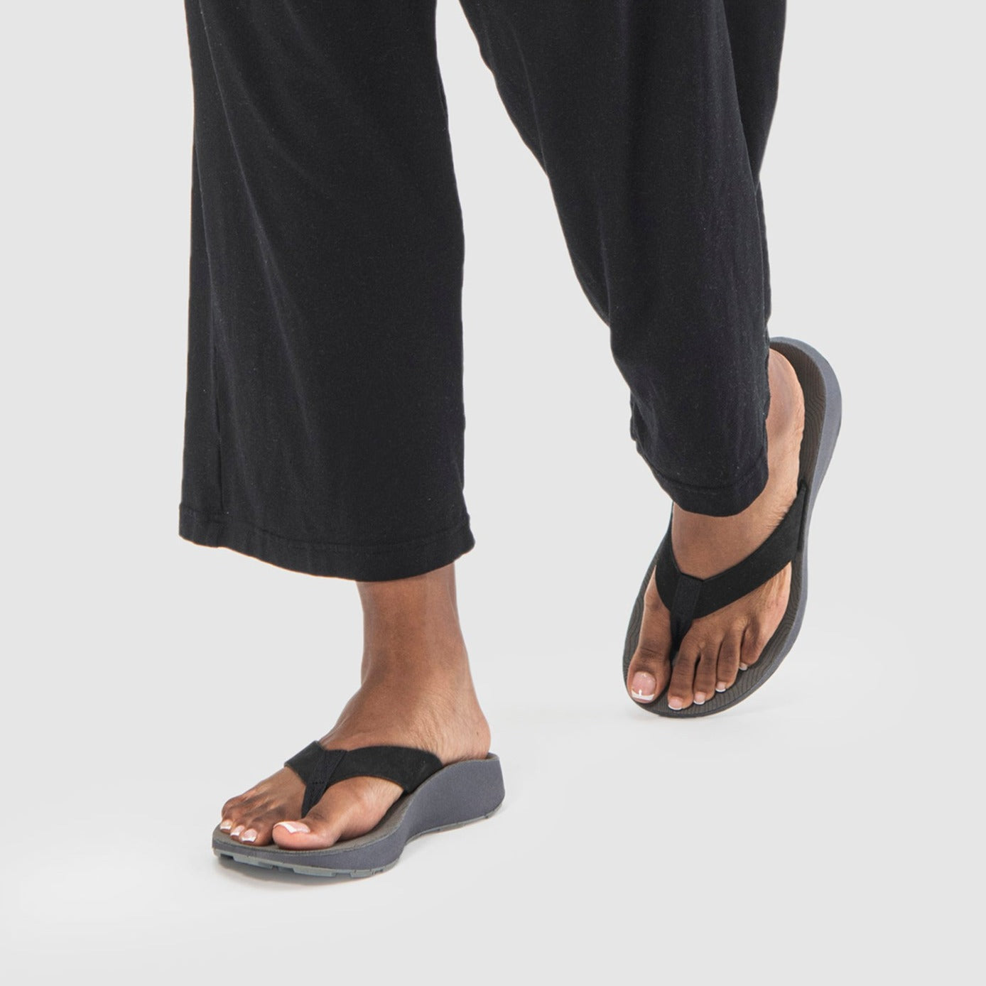 Woman wearing Women's Orleans Leather Sandals in Black.