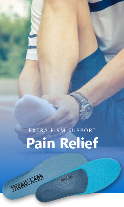 Person holding their foot with Tread Labs Pace Insoles with the caption Extra Firm Support - Pain Relief