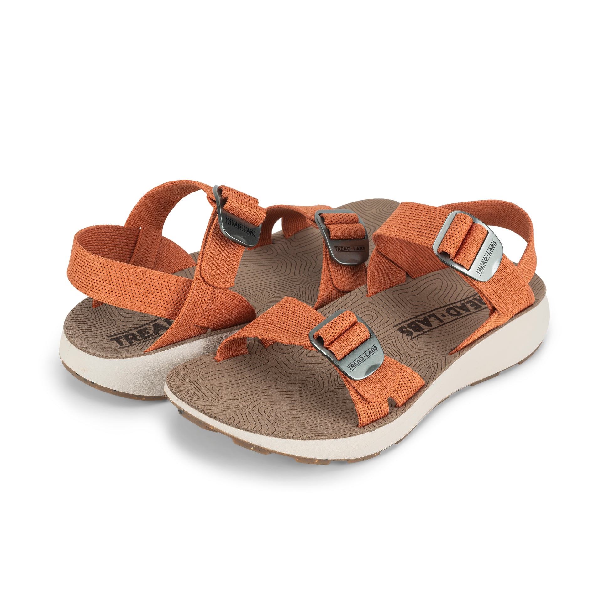 Pair of Women's Salinas Sandal in Apricot on a white background.