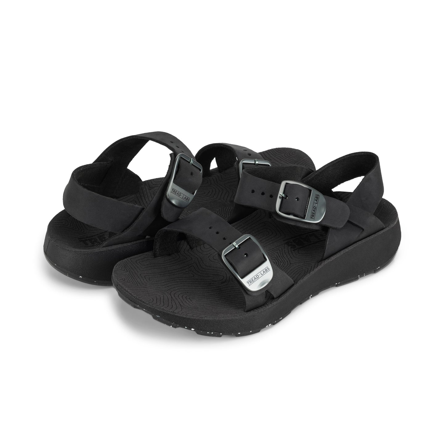 Pair of Women's Salinas Leather Sandals in Black on a white background.