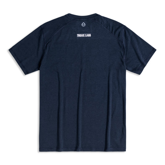 Back view of men's dark blue t-shirt with Tread Labs logo