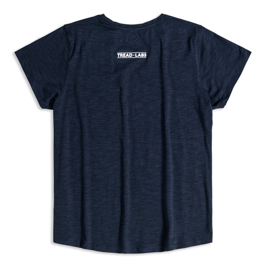 Back view of women's dark blue t-shirt with Tread Labs logo