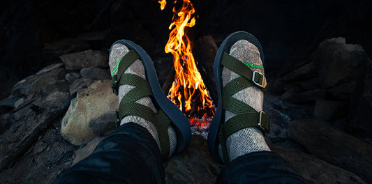 Men's Redway Sandals worn with socks by a campfire