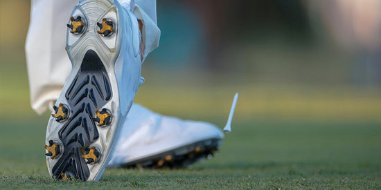 Closeup of men's golf shoes with Tread Labs insoles inside