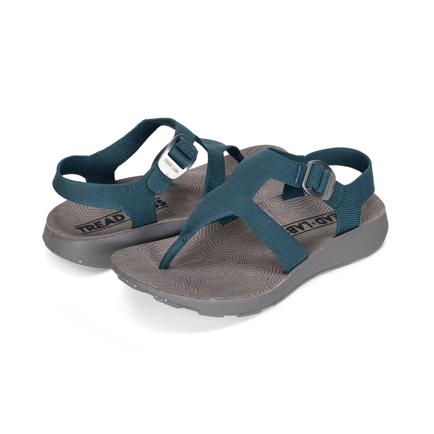 Pair of Men's Albion Sandal in Deep on a white background.