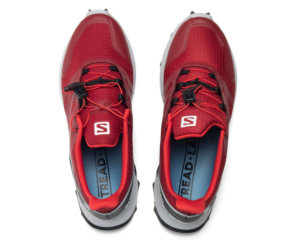 Red athletic sneakers with Tread Labs insoles visible