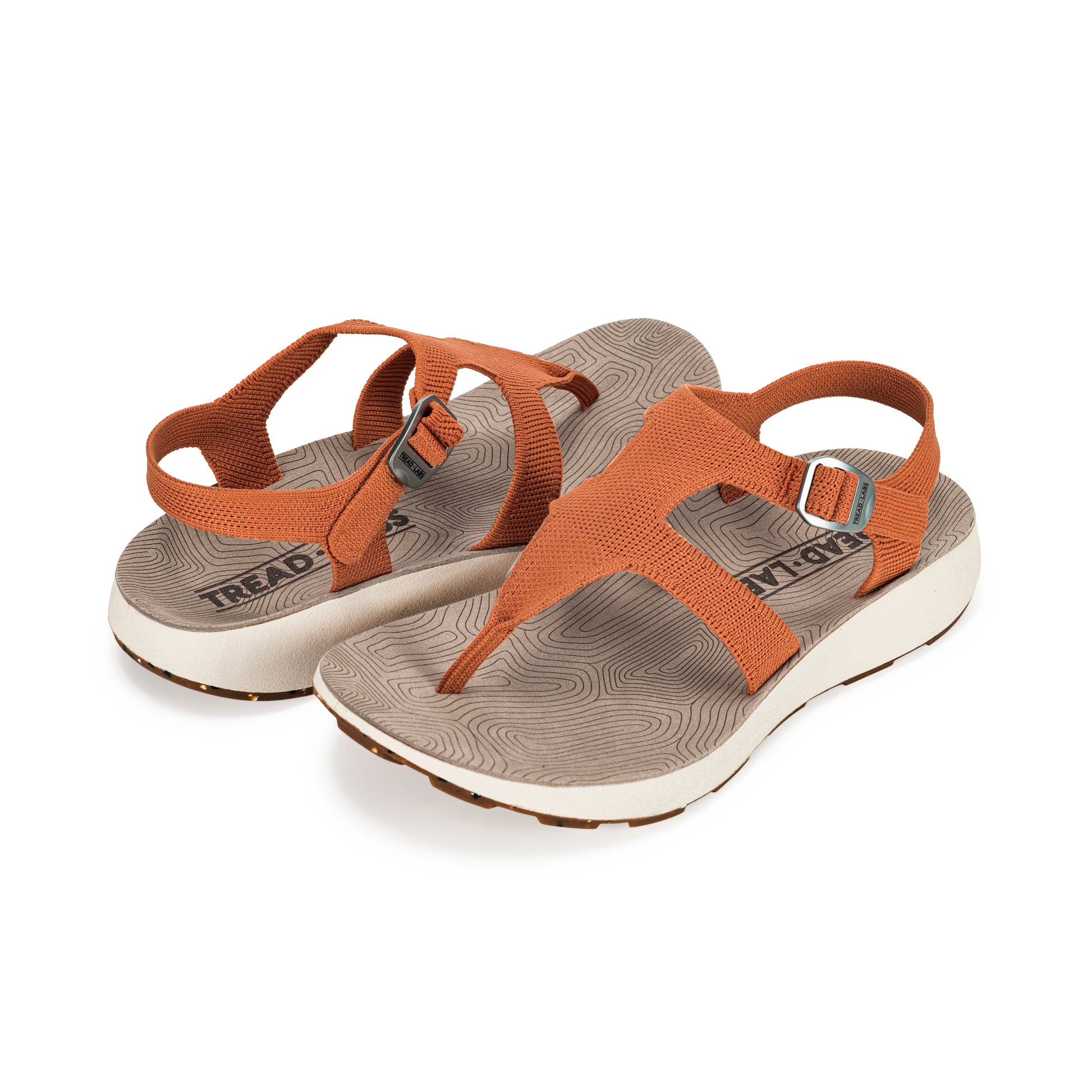 Pair of Women's Albion Sandals in Apricot on a white background.