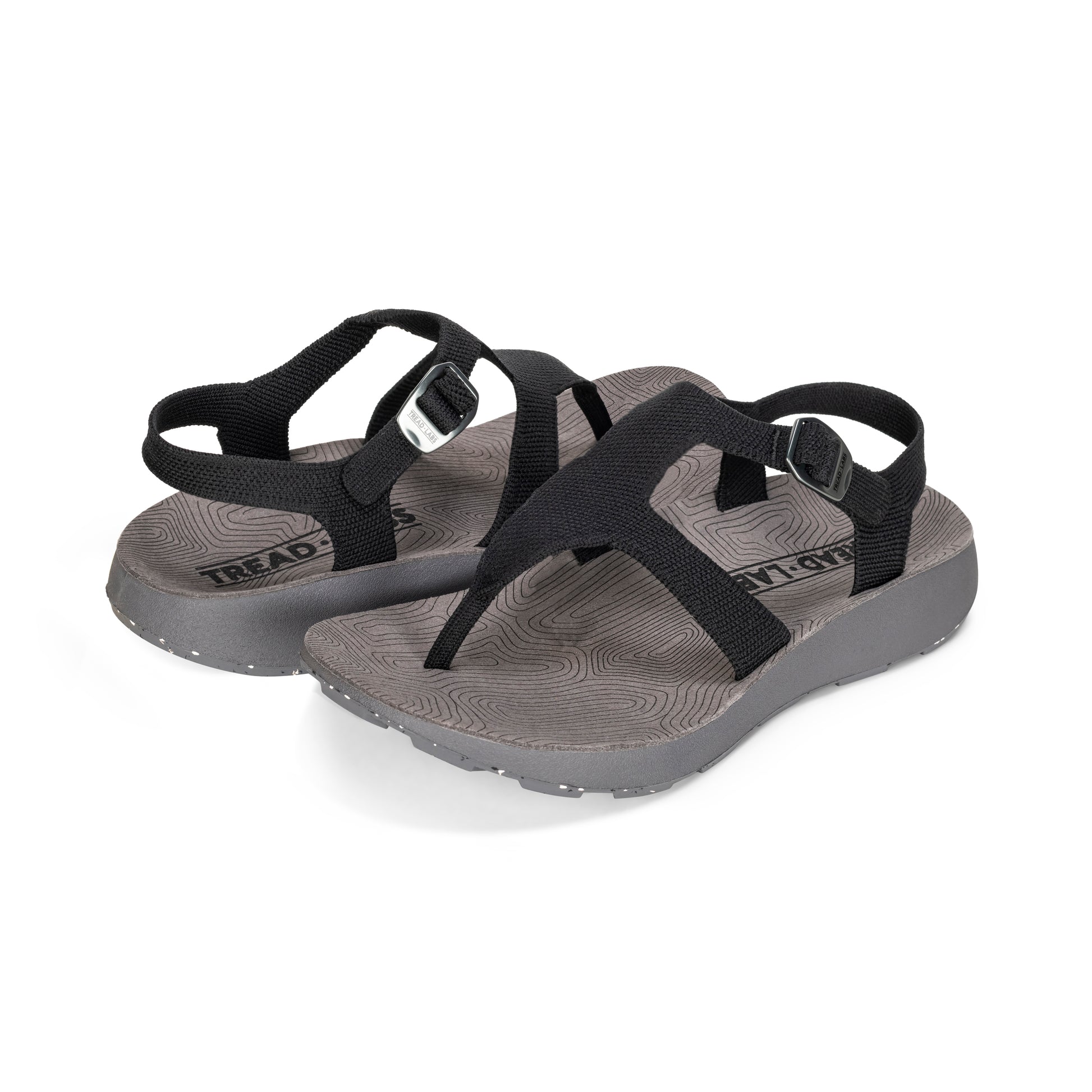 Pair of Women's Albion Sandals in Black on a white background.